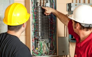 electricians-with-electrical-panel