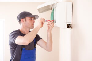 Technician working on HVAC system.